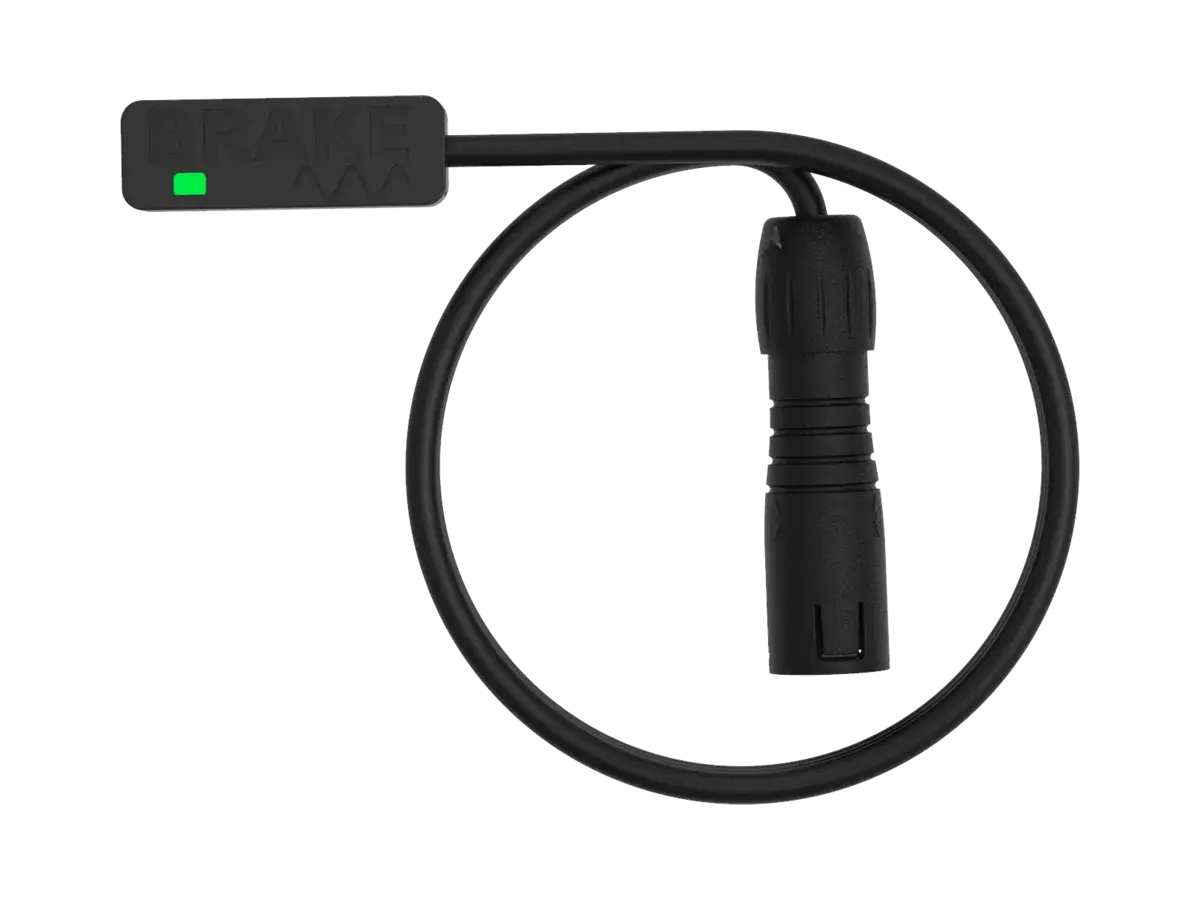 The BYB Tech analog brake sensor with a V3 connector: a slim body with SENSOR moulded into it and a green indicator, a coiled cable, and a straight all-plastic keyed plug on the end.