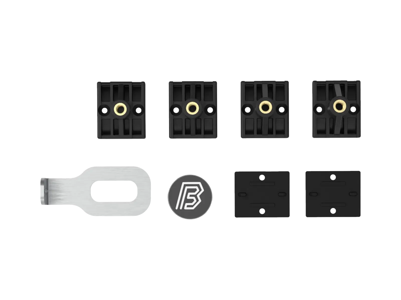 The MTB fork mounting kit from a second angle, the four plastic mountings in a row with the steel bracket and aluminium cap beside them.