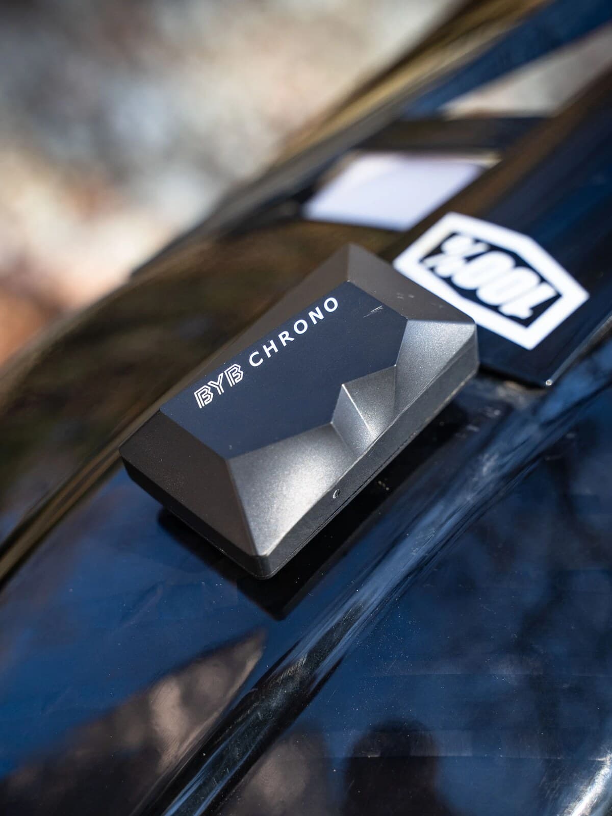 A BYB Chrono mounted on the top of a full-face helmet.