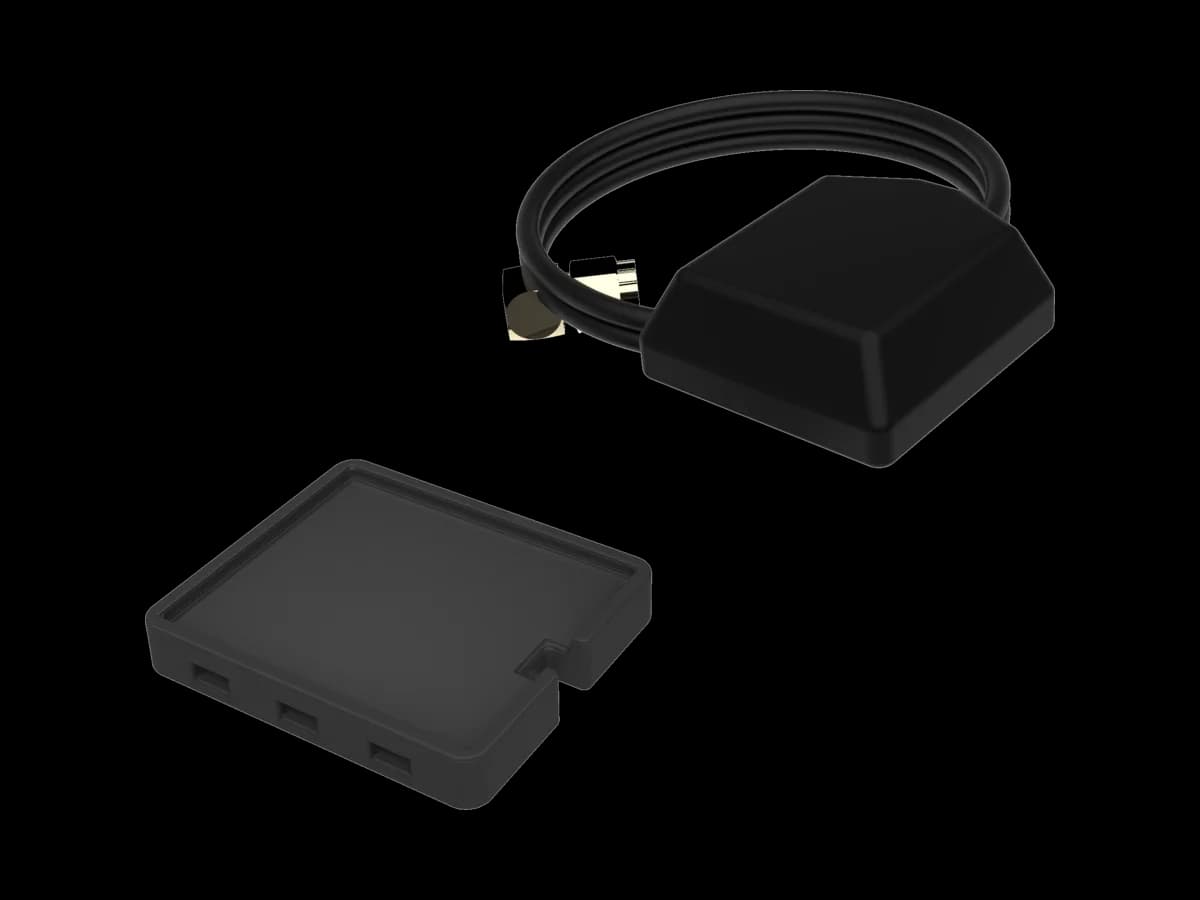 The BYB Tech GPS antenna shown twice in one frame: the flat black patch from above with its cable coiled behind, and the same patch turned over to show the mounting face.